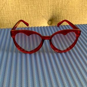 Red sunglasses with heart in frame